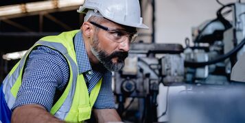 A,Senior,Mechanical,Engineer,In,A,Safety,Uniform,Wearing,Glasses