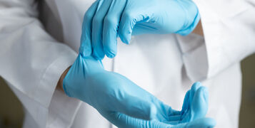 Doctor,Wearing,Blue,Nitrile,Gloves
