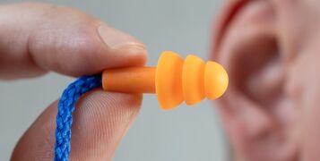 Silicone,Ear,Plugs,For,Human,Ears,On,White,Background