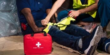 Emergency,Staff,In,Safety,Suit,Help,A,Man,Who,Has