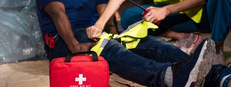 Emergency,Staff,In,Safety,Suit,Help,A,Man,Who,Has